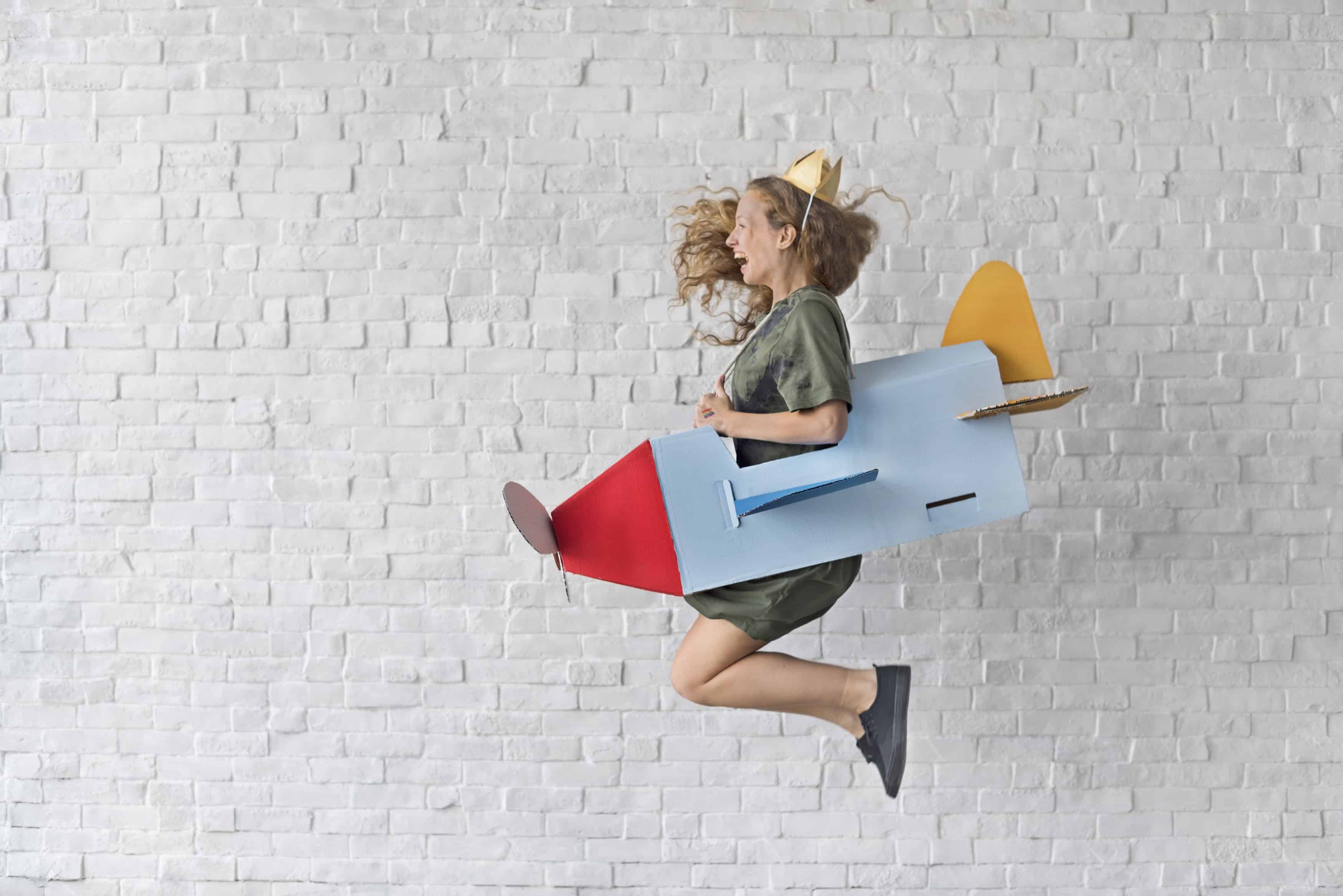 Girl flying in a little plane